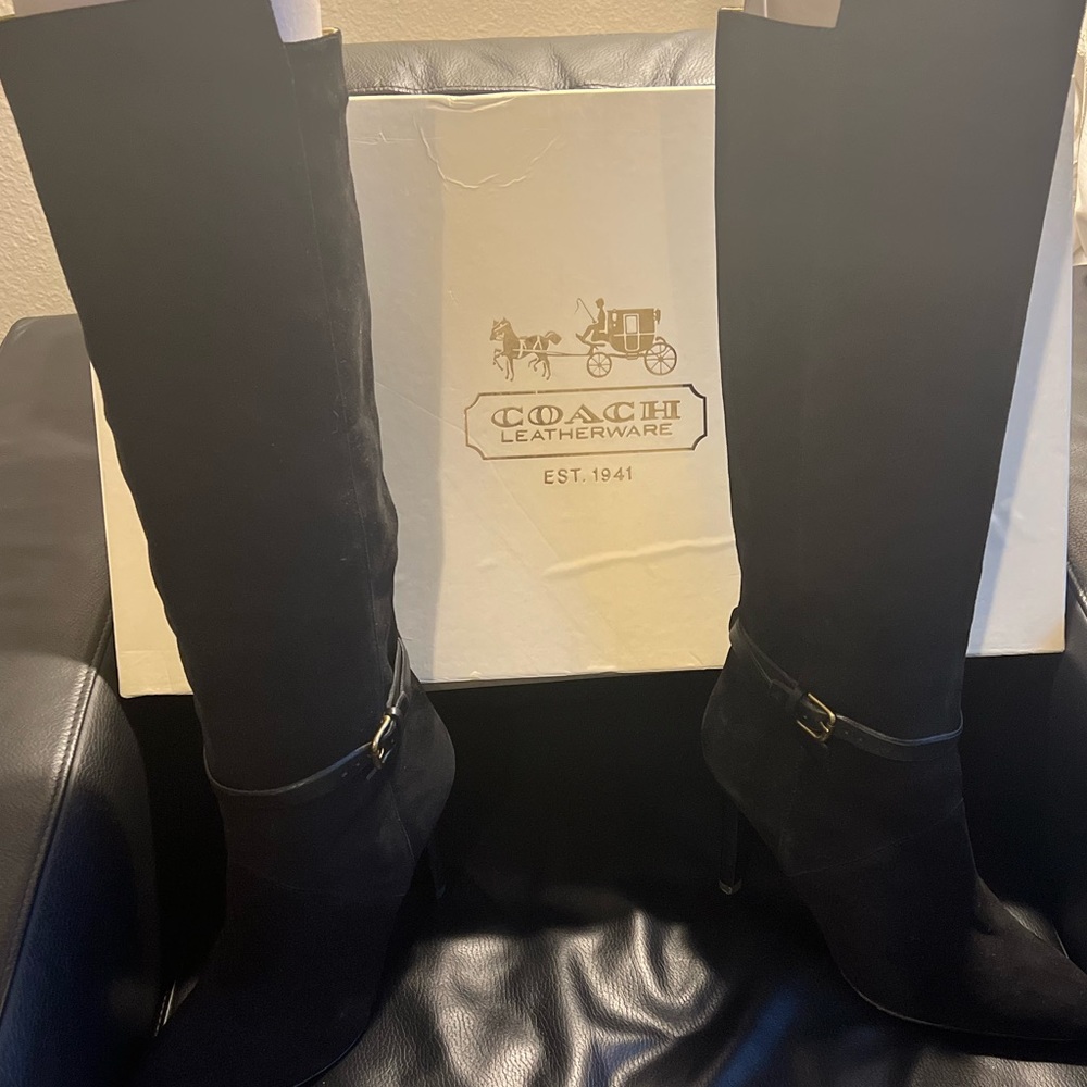 Coach tall suede high heel boots with boot belt accent.